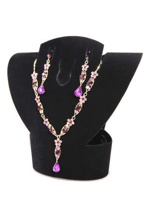 gold necklaces and earrings on dummy isolatedの写真素材