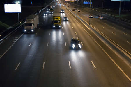 night wide highway with moving carsの写真素材