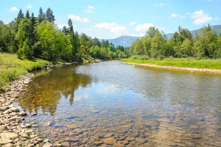 beautiful landscape river mountain wood skyの写真素材