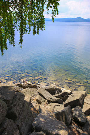 Stony coast of lake Turgoyak Ural Russiaの写真素材