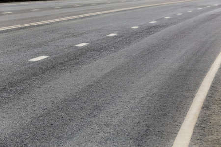 asphalt paving on highway turn close upの写真素材