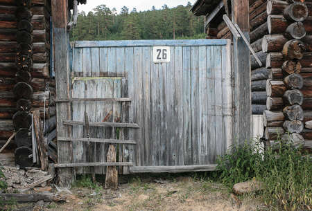 wooden gate of an old log houseの写真素材