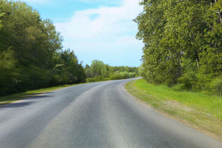summer landscape with road and skyの写真素材