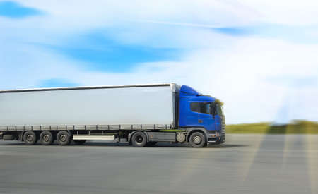 big truck goes on  way to sky backgroundの写真素材