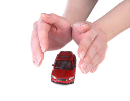 red toy car in female handsの写真素材