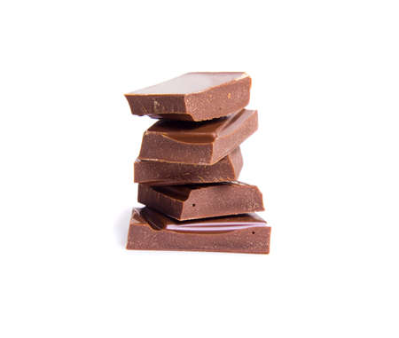 chocolate pieces isolated on white backgroundの写真素材