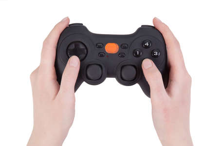 black joystick in female hands isolated on whiteの写真素材