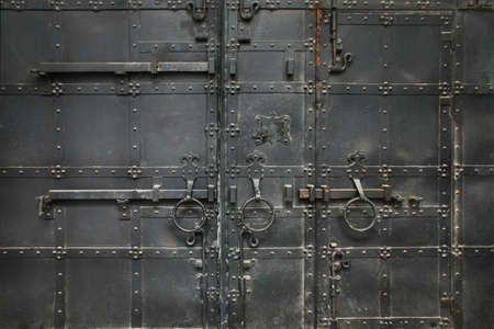 ancient metal black gate close upの写真素材