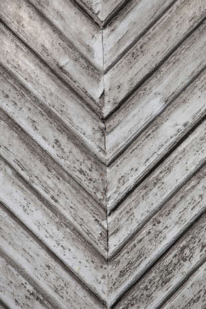 old wooden short levels on wall at an angleの写真素材