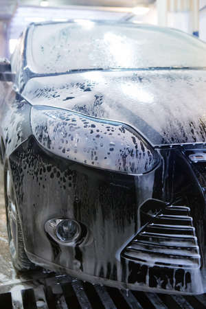 blue car on car wash in penalty fee close upの写真素材