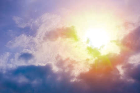 beautiful bright sunset in cloudy skyの写真素材