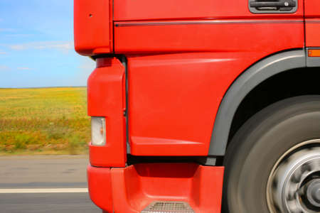 red truck close up goes on highwayの写真素材