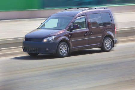 modern car moves on city streetの写真素材