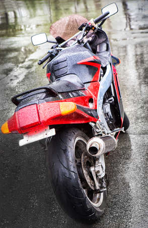 new beautiful motorcycle in rain on asphaltの写真素材