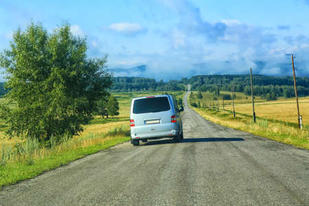 minibus on the country highway against landscapeの写真素材