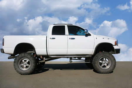 White off-road car on the big wheelsのeditorial素材