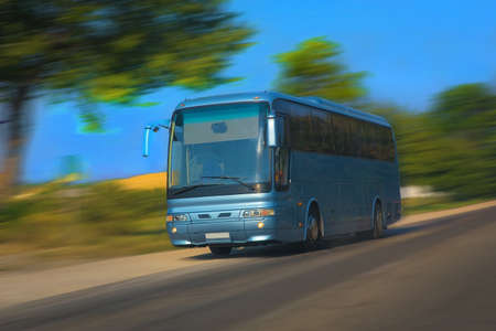 tourist bus goes on the highway in the summerの写真素材
