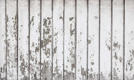 wooden boards covered with white cracked paintの写真素材
