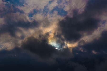 beautiful bright sunset in cloudy skyの写真素材