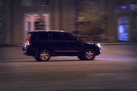 modern cars go on night cityの写真素材