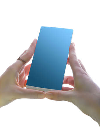 smartphone in female hands isolated on white backgroundの写真素材