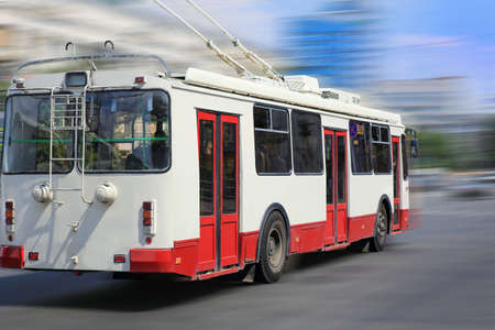 modern trolleybus goes on the city streetの写真素材