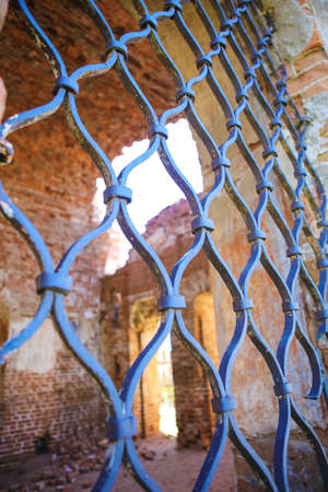 lattice window and interior of old ruins of churchの写真素材