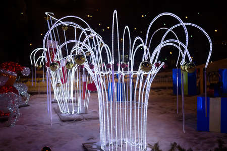 Christmas light garlands in the night cityの写真素材