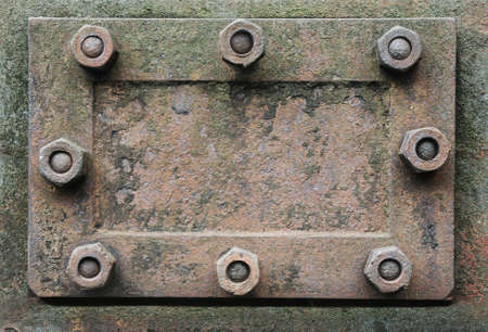 rusty metal hatch with nutsの写真素材