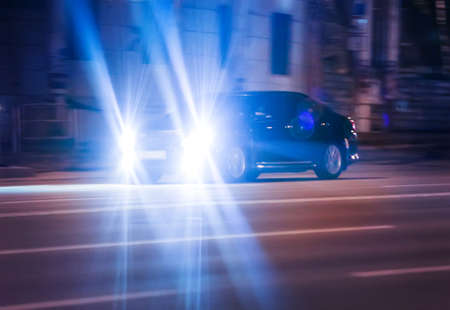 modern cars go on the night cityの写真素材