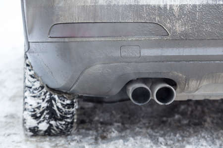 exhaust pipe car smoke winter snowの写真素材