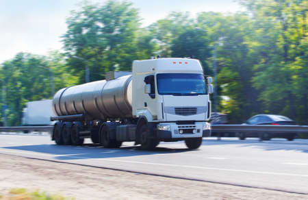big gas-tank truck goes on highwayの写真素材