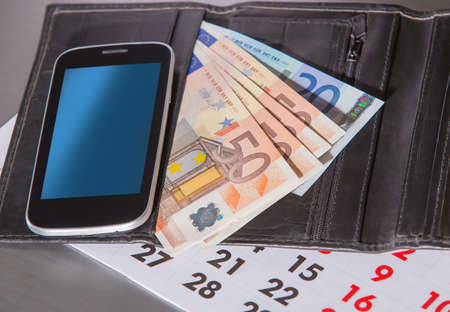 euro banknotes purse calendar closeupの写真素材