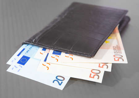 euro banknotes in brown leather purseの写真素材