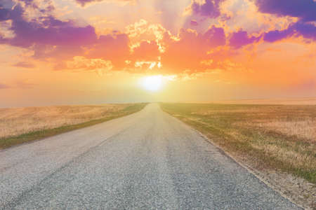 beautiful sunset over the country highwayの写真素材