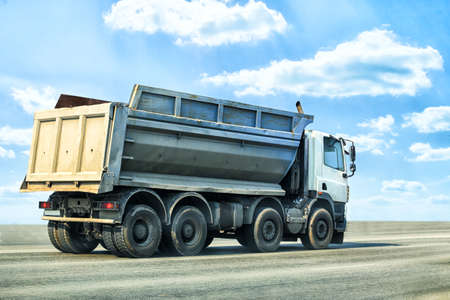 big dump truck goes on highwayの写真素材