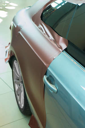pasting of car carbonic plastic closeup