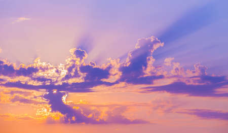 beautiful bright sunset in cloudy skyの写真素材