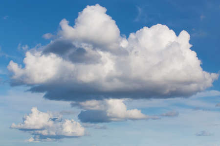 blue sky with clouds closing the sunの写真素材