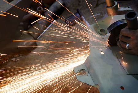 sparks from metal polishing by the grinder