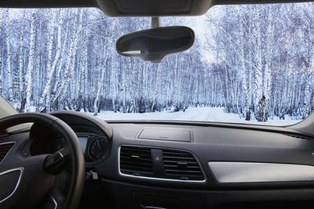 winter snowy forest in the cabin carsの写真素材