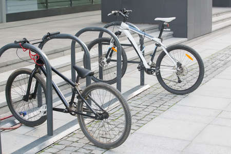 two bikes on the Bicycle parking in the cityの写真素材