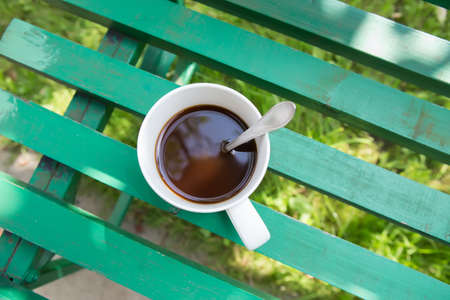 morning black coffee in cup outdoorsの写真素材