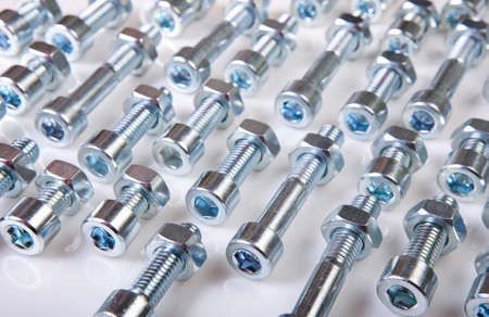 bolts with nuts isolated on white background