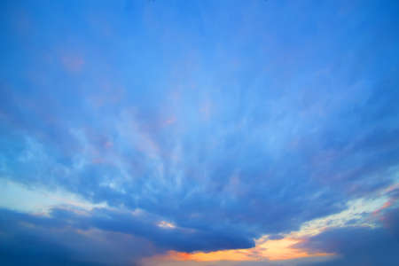 beautiful bright sunset in cloudy sky