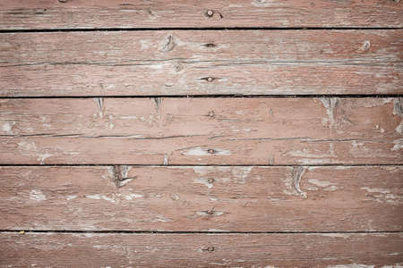 wooden boards covered with cracked paint backgroundの写真素材