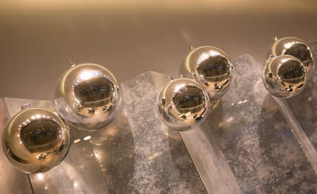 Christmas balls hanging in the interior of the wallの写真素材