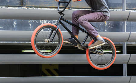 cyclist jump on bicycle closeup detailの写真素材