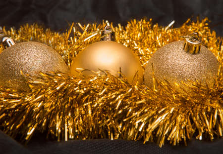 Christmas balls and tinsel on a black backgroundの写真素材