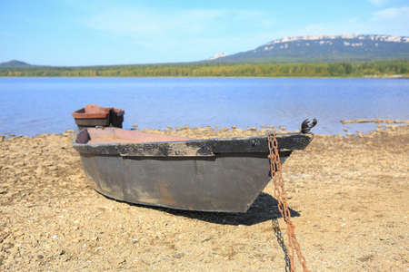 boats on bank of lake in summerの写真素材